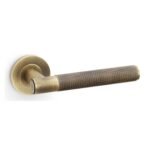 Alexander & Wilks AW220AB Spitfire Knurled Lever On Round Rose - Antique Brass (LEAD TIME: 2-3 DAYS)